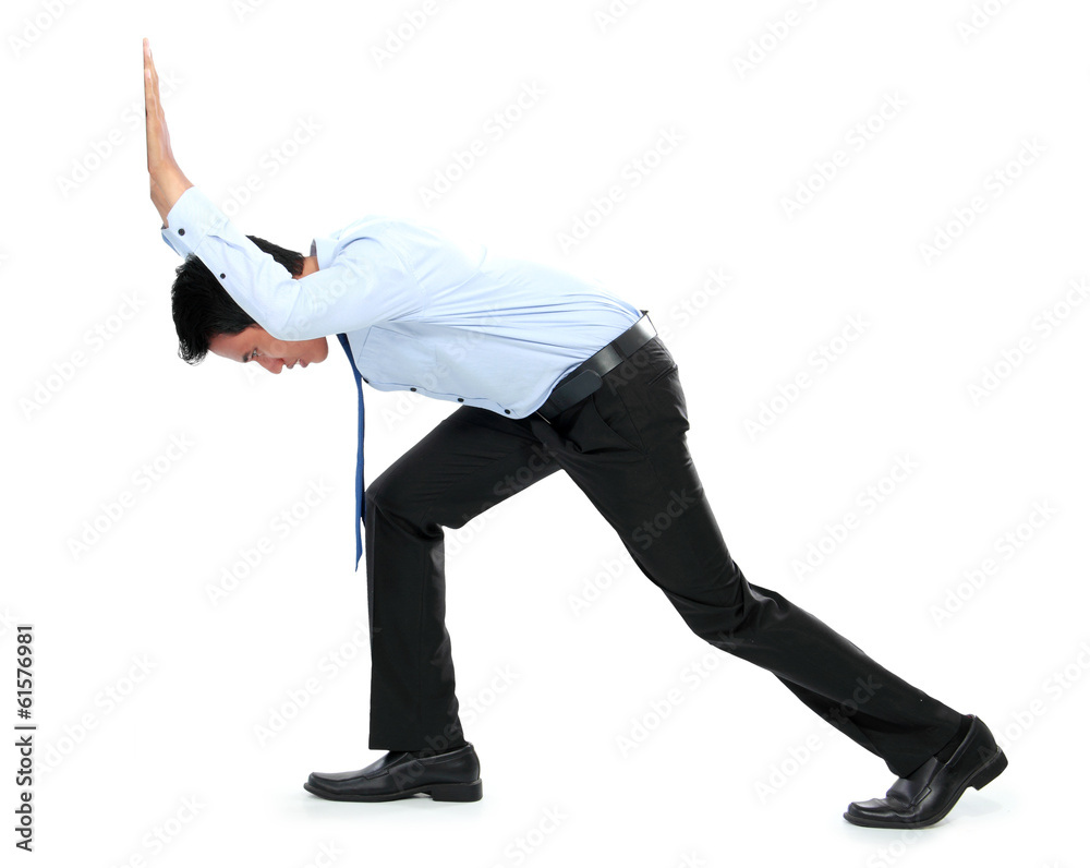 Fototapeta premium Young businessman pushing a blank board