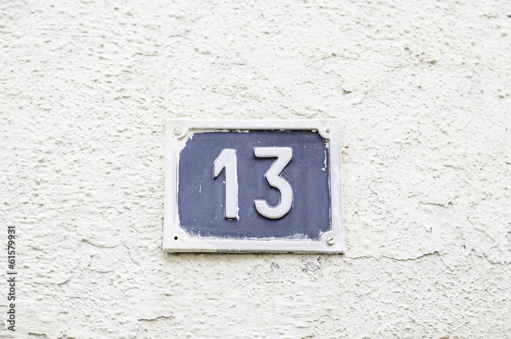 Number thirteen on a wall in a house Number thirteen on a wall in a house