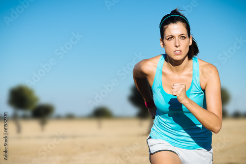 Sporty woman cross country running