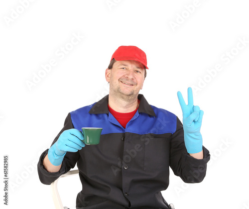 Worker with cup of coffee.