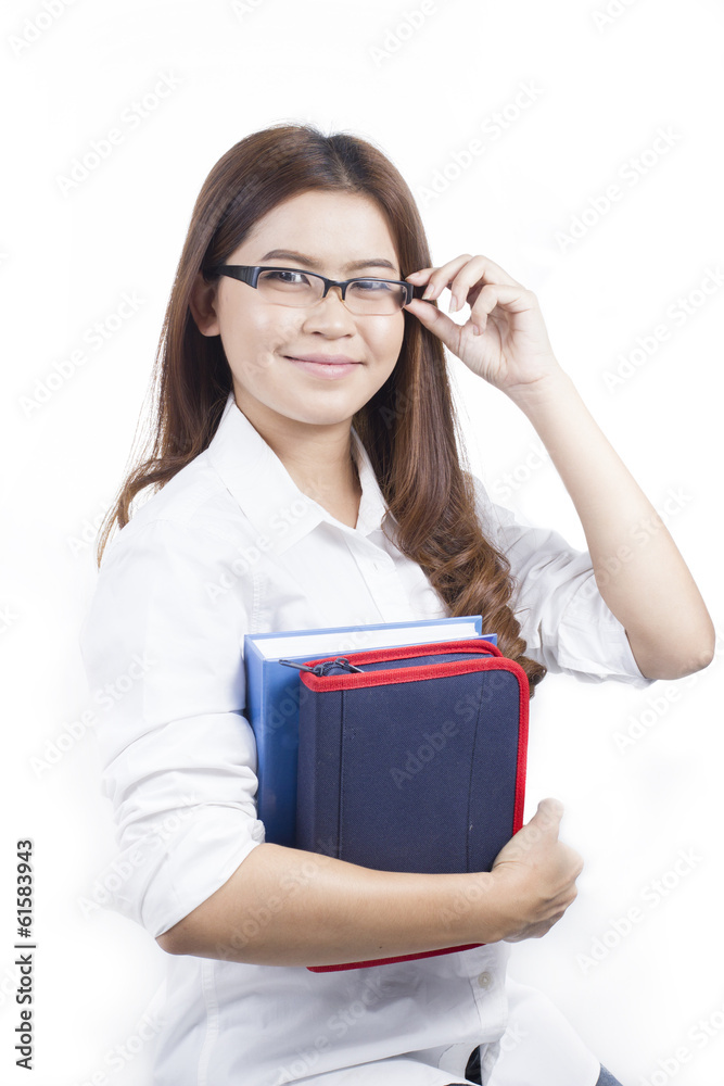 Portrait of Asian woman holding books in White background Portrait of Asian woman holding books in White background