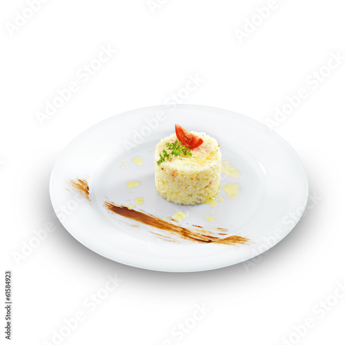 Health vegetarian rice with tomato and butter on a round plate i