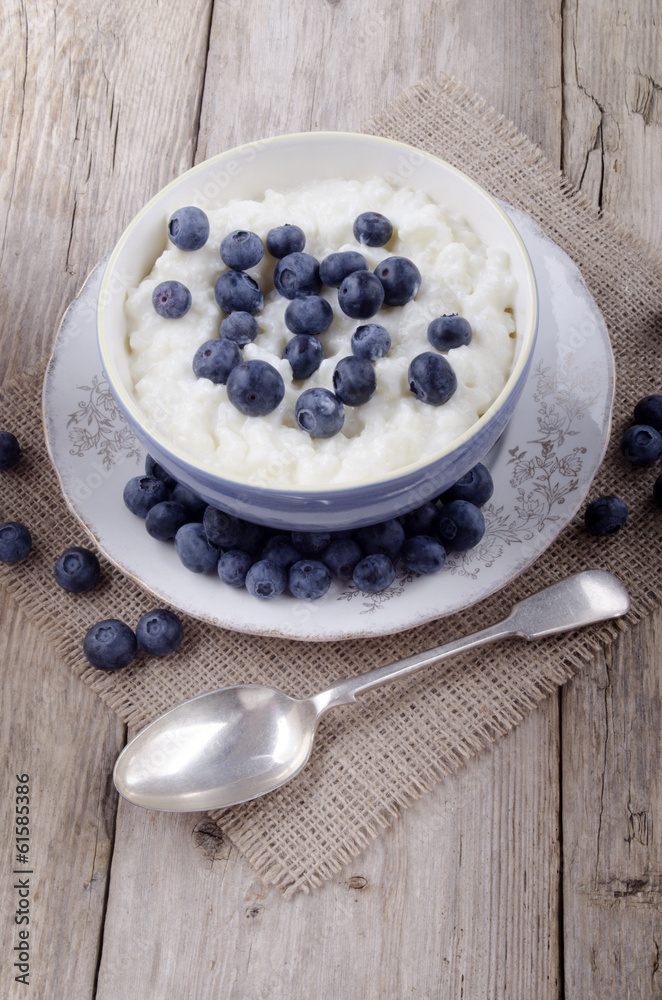 rice pudding and blueberries in a bowl rice pudding and blueberries in a bowl