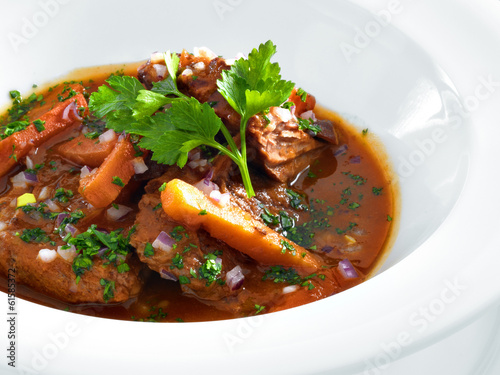 Rich hot hungarian beef goulash with traditional topping served