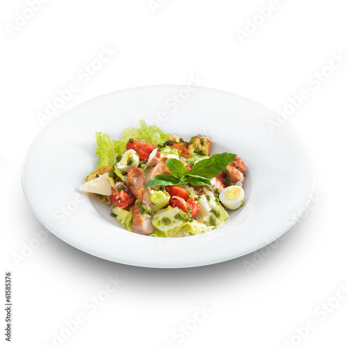 Tasty healthy Caesar salad with sweet basil and lettuce on a rou