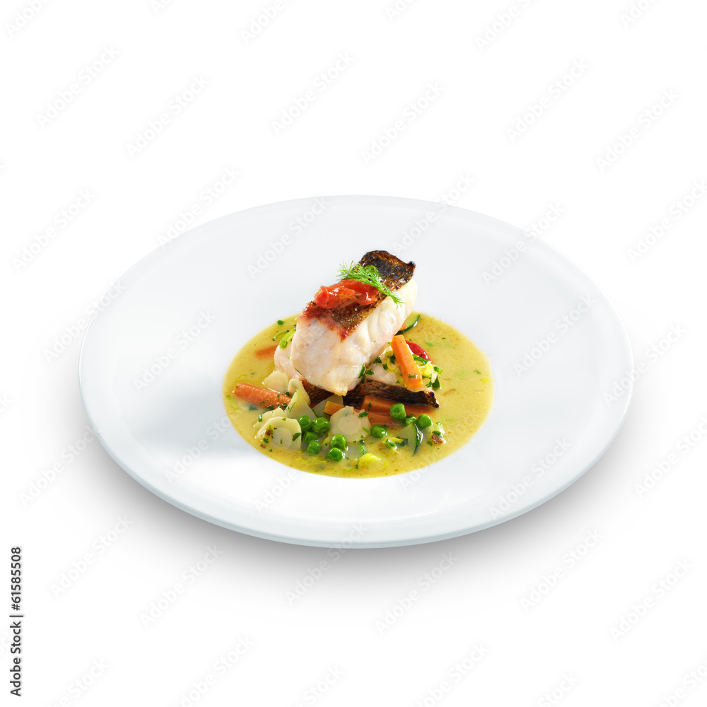 Fish an vegetables on plate isolated on white Fish an vegetables on plate isolated on white