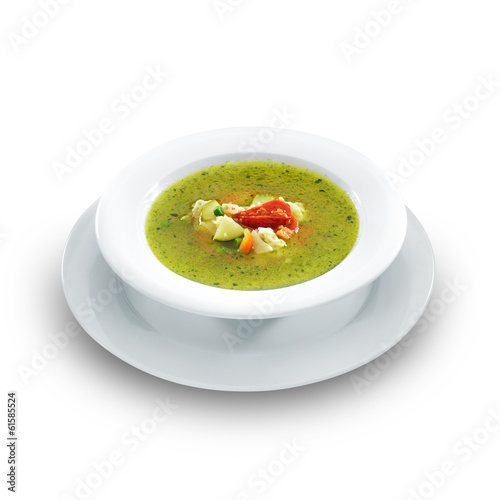 Hot vegetarian healthy soup with pesto sauce, noodles and vegeta