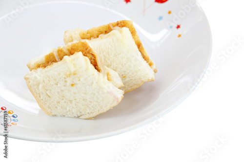 Bread sandwiches in White dish.