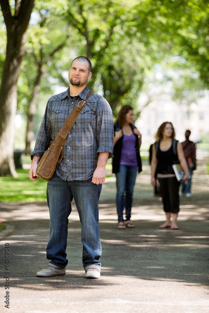 Confident Male Student On Standing Campus Road Confident Male Student On Standing Campus Road