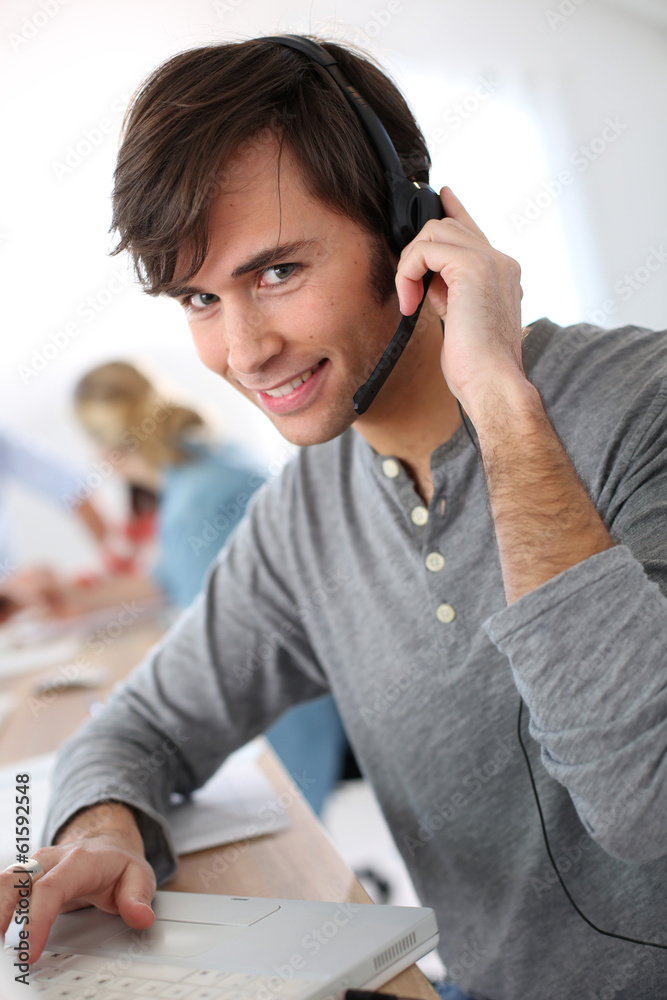 Student with headset on doing English language test Student with headset on doing English language test