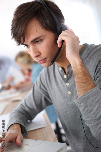 Student with headset on doing English language test photo