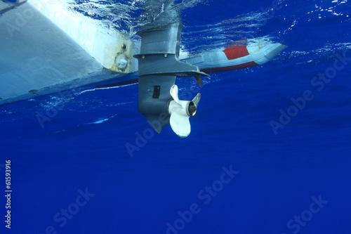 Outbord propeller of rubber boat photo