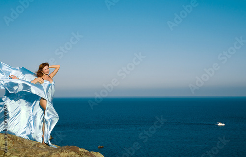 red-haired girl in a blue dress