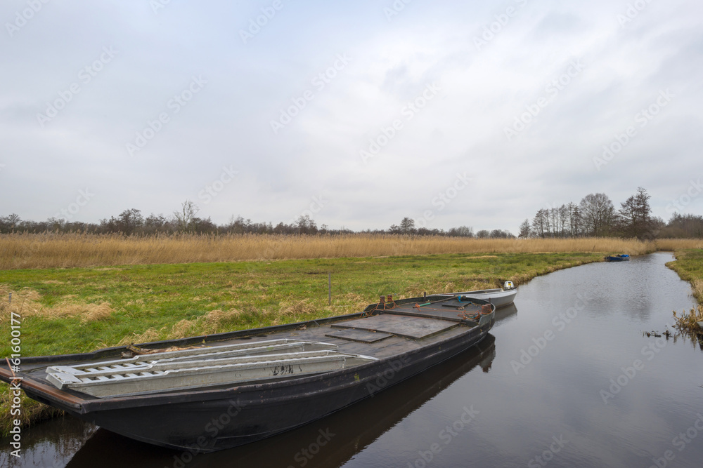 Boat in a canal through the countryside Boat in a canal through the countryside