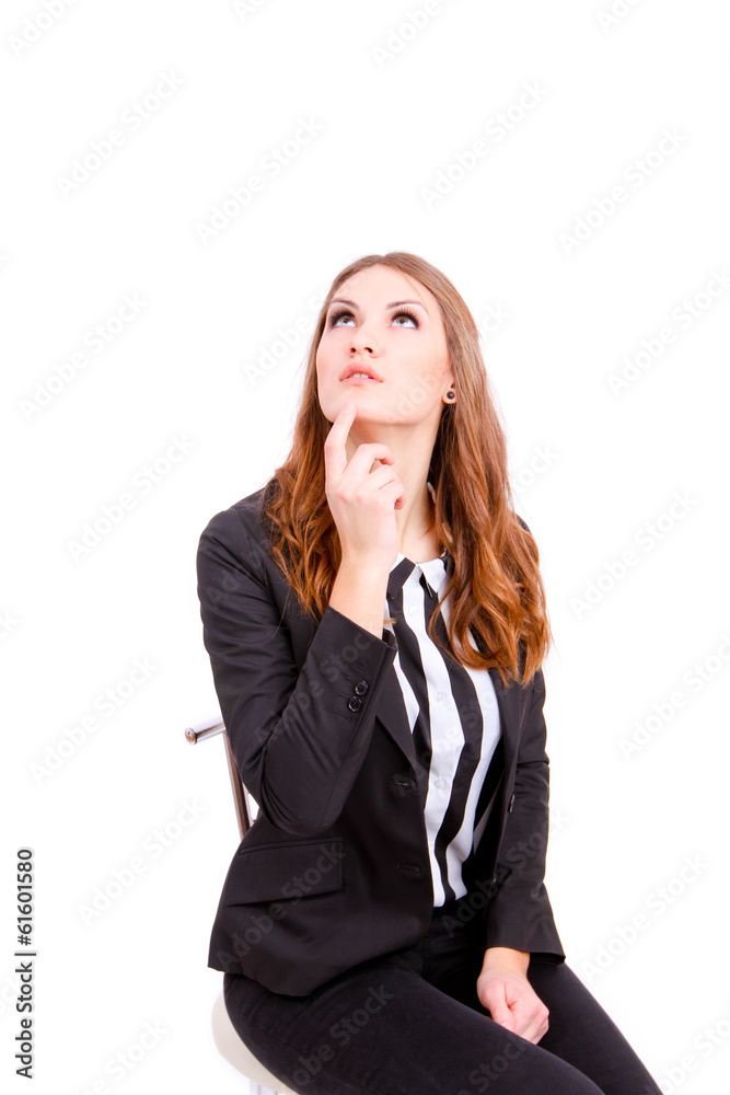 Thoughtful businesswoman looking up - isolated over a white back Thoughtful businesswoman looking up - isolated over a white back