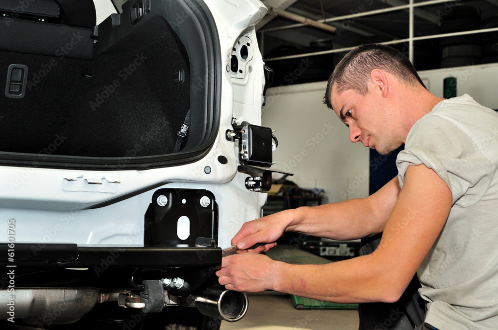 Car mechanic at work. Car mechanic at work.