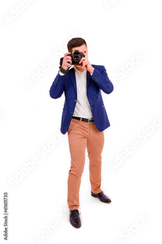 Male photographer with his camera isolated on white background © majesticca