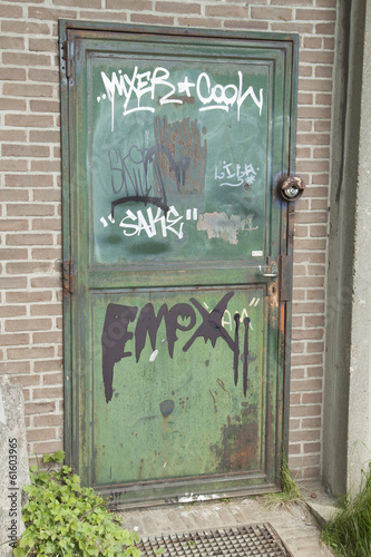 Steel door with graffiti art.