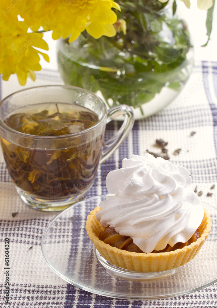 Herbal tea in glass cup and flowers Herbal tea in glass cup and flowers