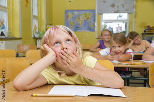 Schoolgirl yawning