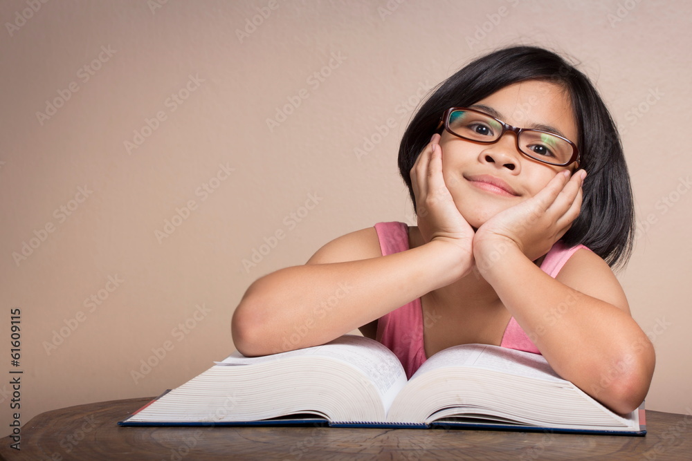 Happy young woman reading a book Happy young woman reading a book
