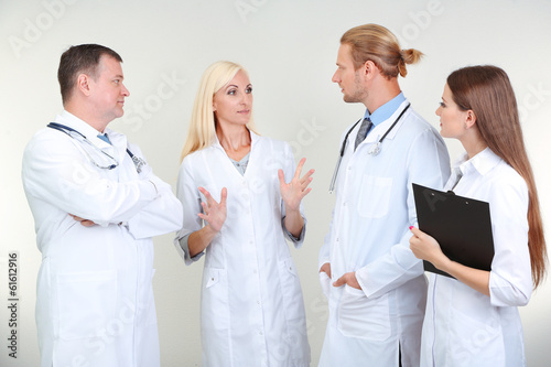 Medical workers on grey bac...
