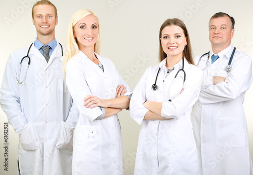 Medical workers on grey background