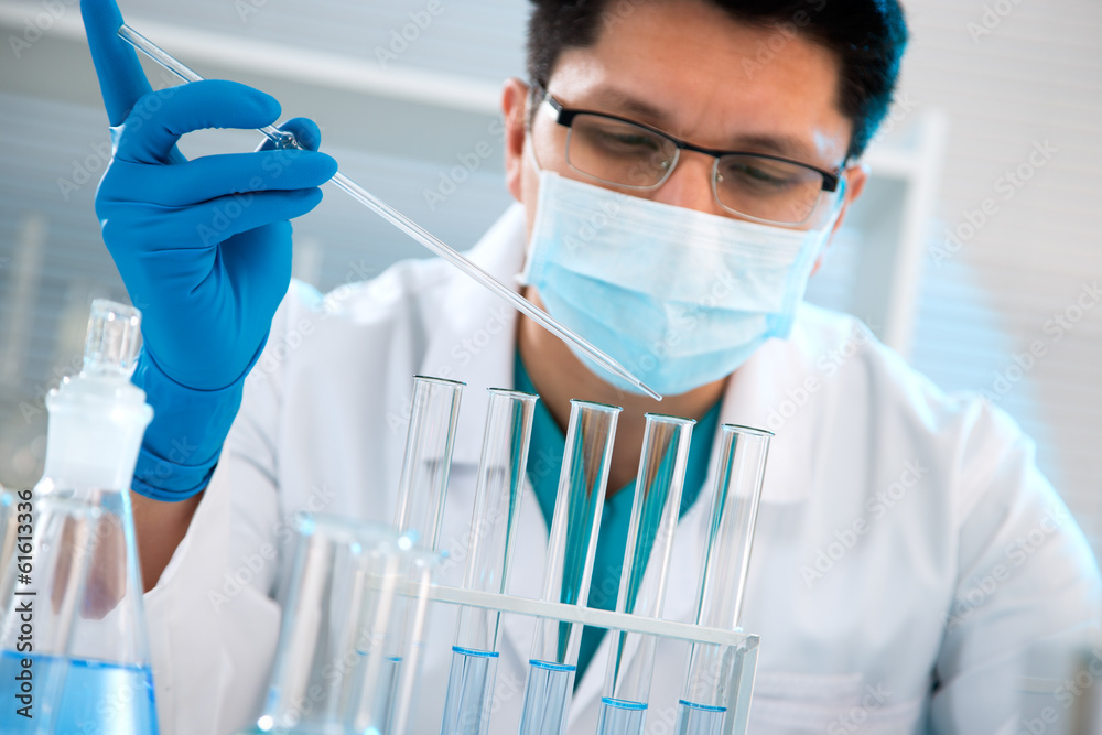 Medical scientist working in laboratory Medical scientist working in laboratory
