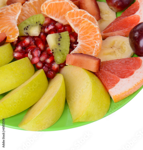 Sweet fresh fruits on plate close-up
