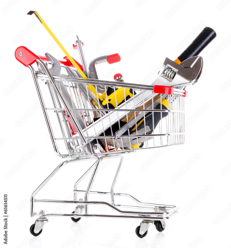 Construction tools in shopping cart isolated on white Stock Photo