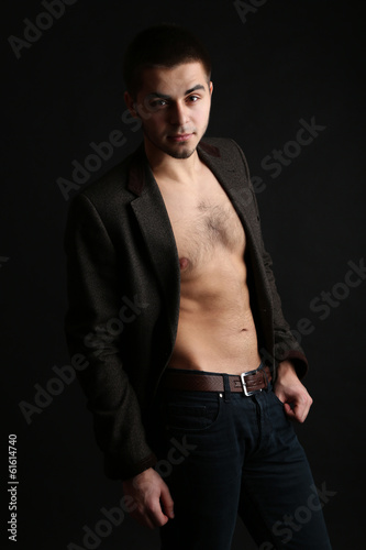 Handsome young man on dark background