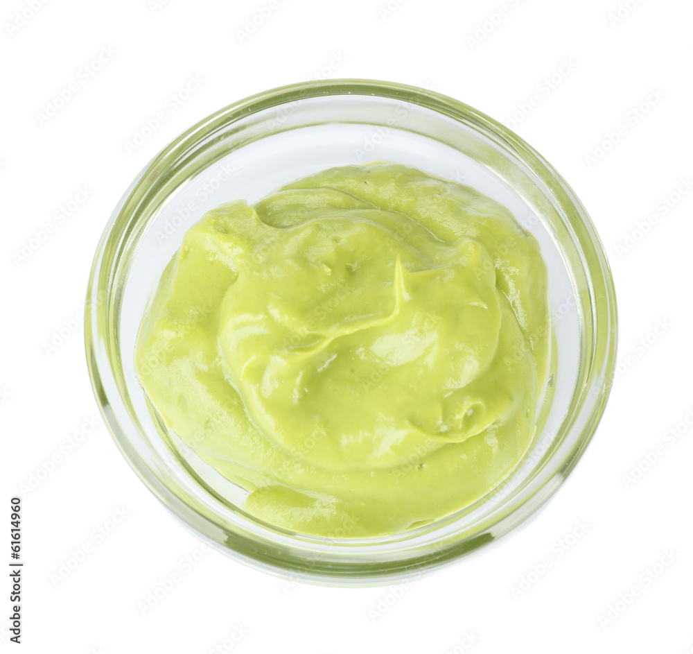 Fresh guacamole in bowl isolated on white Fresh guacamole in bowl isolated on white