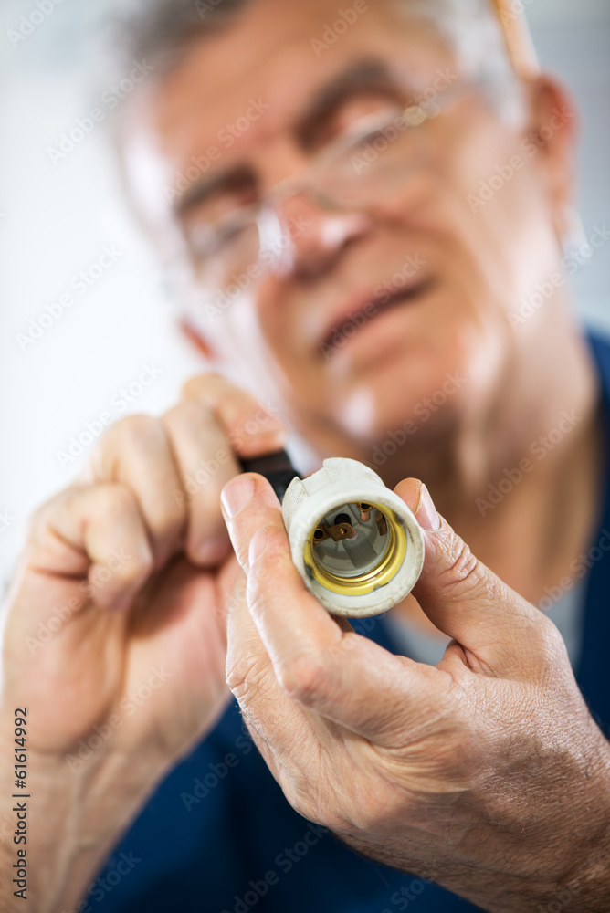 Fototapeta premium Repairing Old Bulb socket