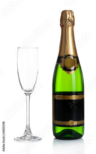 Bottle of champagne and empty champagne glass, isolated on