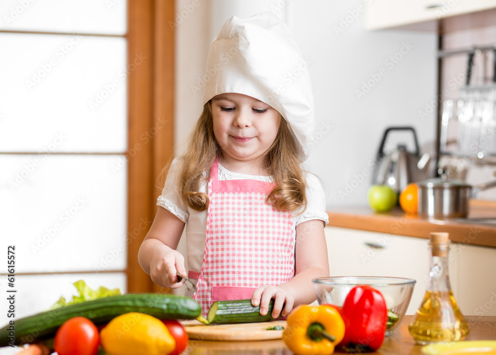 Chef girl preparing healthy food at kitchen Chef girl preparing healthy food at kitchen