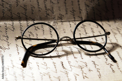Old glasses on a letter