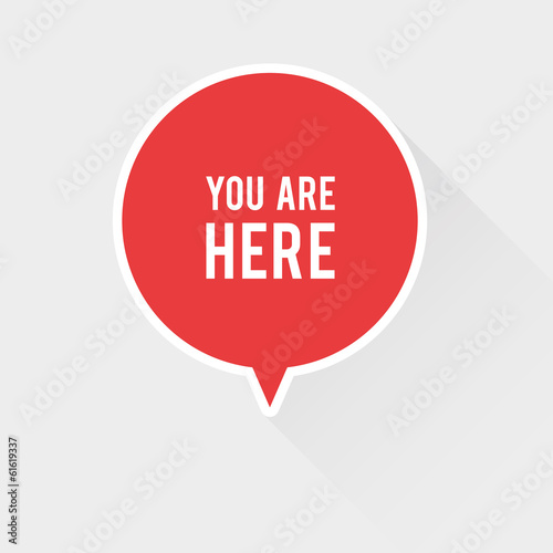 You are here sign with long shadow