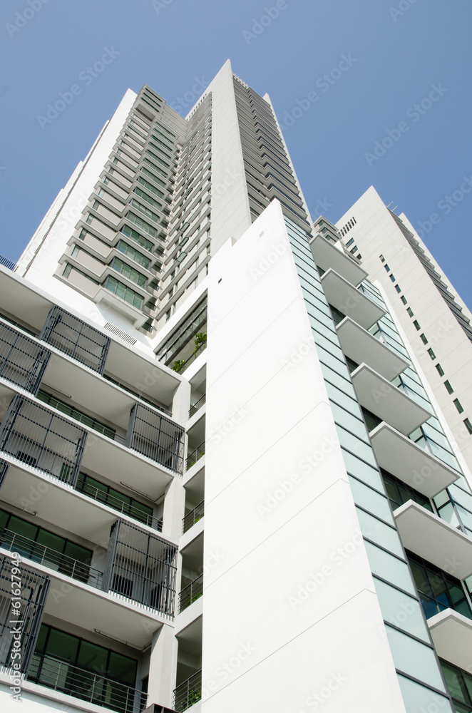 Modern residential condominium with clear blue sky Modern residential condominium with clear blue sky