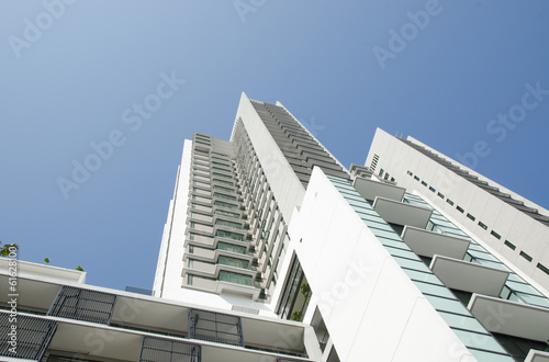 Modern residential condominium with clear blue sky © huislaw