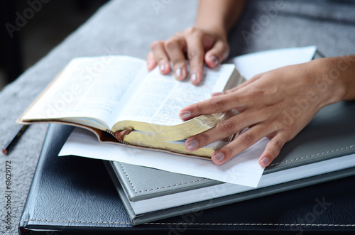 Closeup hand open book for reading concept background