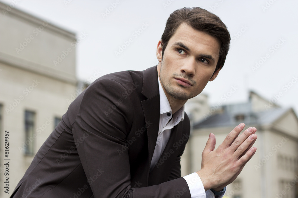 Businessman in front of a building- Stock Image Businessman in front of a building- Stock Image