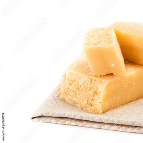 Parmesan Cheese  Isolated on White Background close up. Piece of