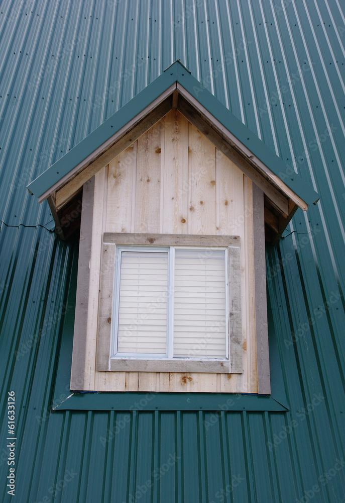 dormer with windows on the dark green roof dormer with windows on the dark green roof