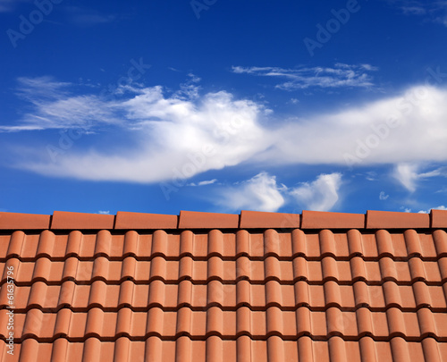 Fotografia, Obraz Roof tiles and sky with clouds