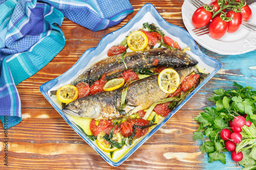 Fish. Roasted mackerel and tomatoes with garlic, basil and lemon