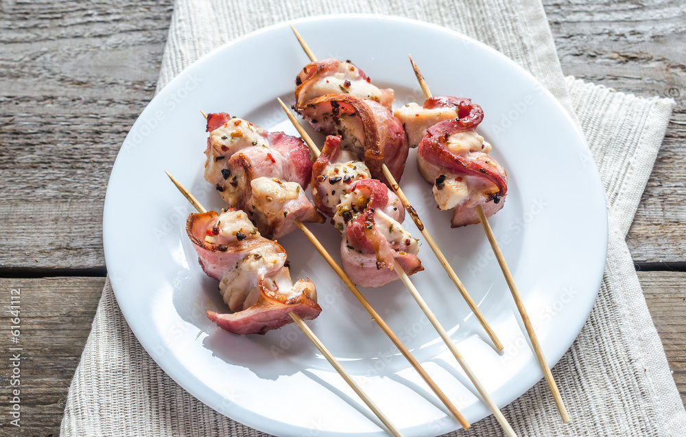 Grilled bacon skewers with chicken meat