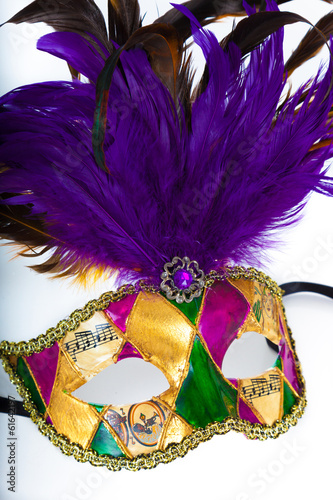 A colorful mardi gras or venetian mask on a white background