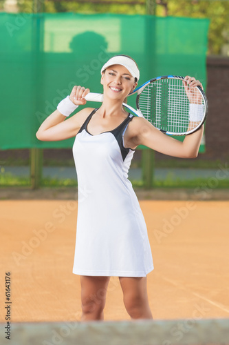 Happy Professional Tennis Player At Court