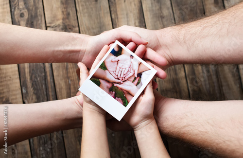 Set of images in family hands photo