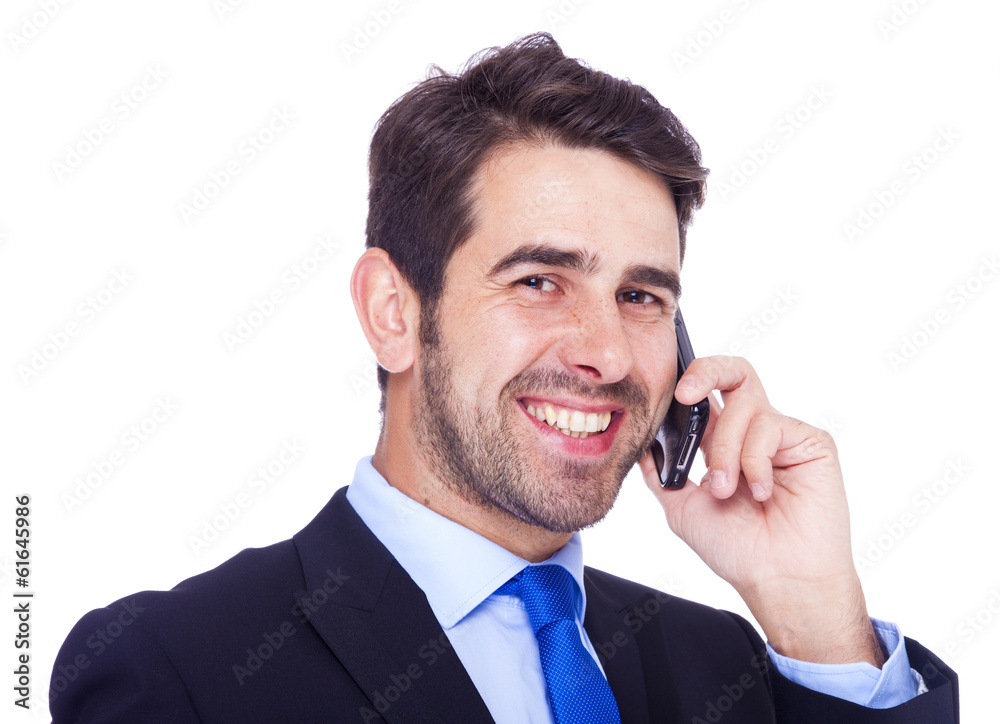 Handsome business man talking on the phone, isolated on a white Handsome business man talking on the phone, isolated on a white